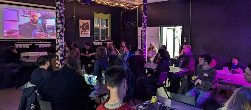People watching a presentation in the Farset Labs event room